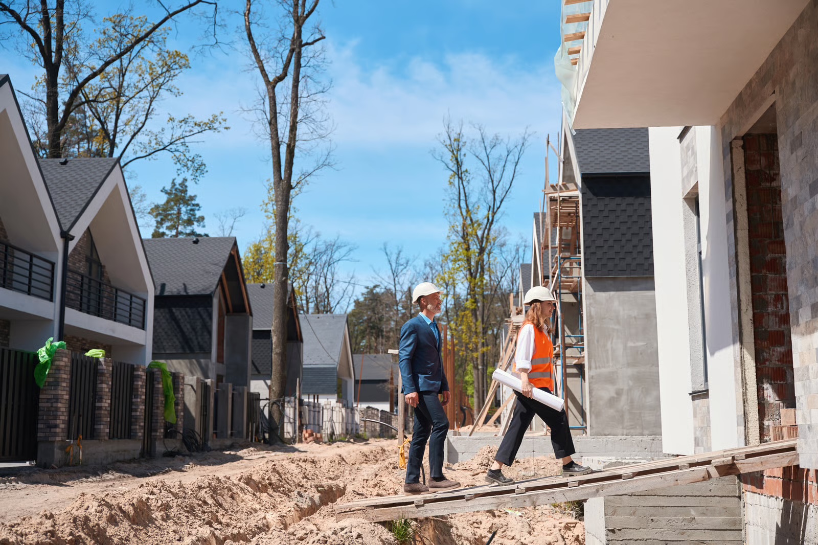 Investor and builder inspecting a new home under construction