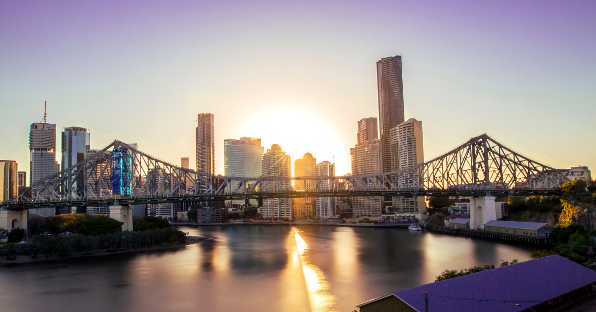 Brisbane city view with standing skyscrapers indicating to invest in Australia