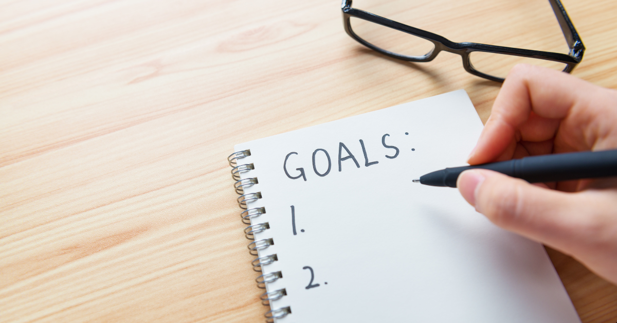 Property Investment Strategies - A person is writing