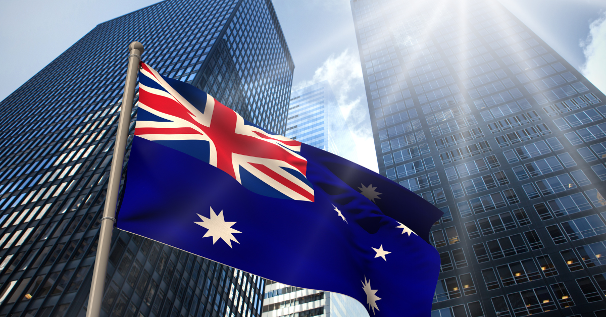 Federal Budget Australia - 2024 Federal Budget Australia Announcement and Australian National Flag in the image infront of two high buildings