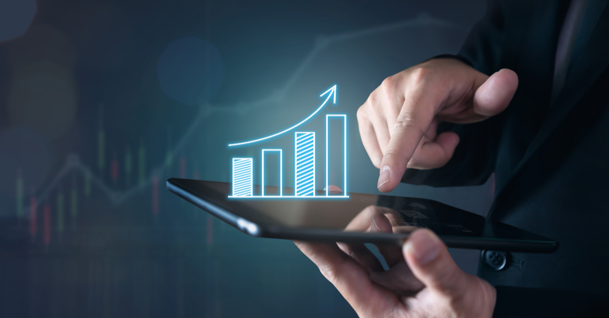 Property investors showing growth on 3D diagram on a tab using a pen